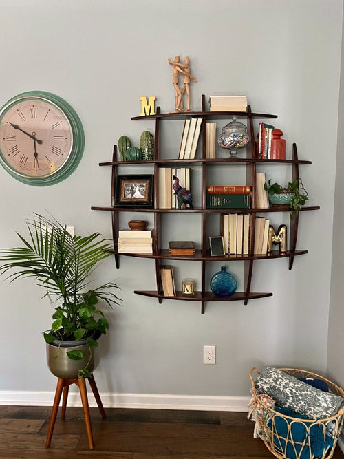 Sphere Shelf, wall-mounted sphere with curved bays in a room